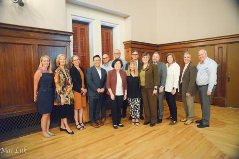 A group of adults smiling. 