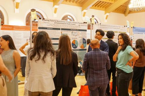 Author presenting poster at the Interprofessional showcase