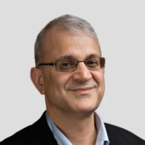 Man with glasses smiling 